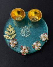 Handcrafted Resin Pooja Thali with Ganesha Design, Golden Diya Bowls & Pearl Floral Embellishments